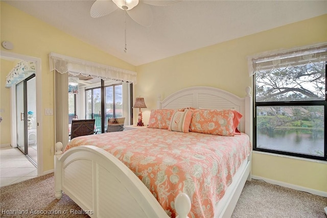 carpeted bedroom featuring ceiling fan and lofted ceiling