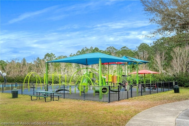 view of jungle gym with a lawn