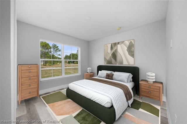 bedroom with hardwood / wood-style floors