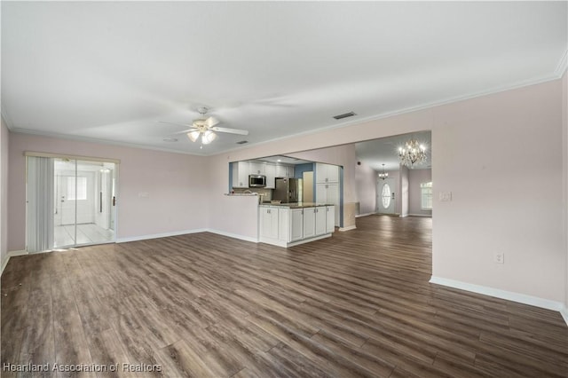 unfurnished living room featuring dark wood-style floors, baseboards, crown molding, and ceiling fan with notable chandelier