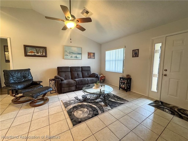 3216 Locust Ave, Lake Placid, FL 33852 - living area with vaulted ceiling, tile patterned flooring, and a ceiling fan