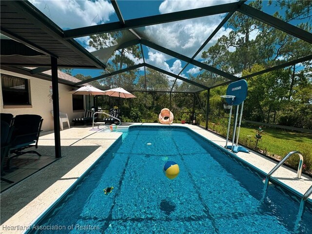 3216 Locust Ave, Lake Placid, FL 33852 - swimming pool featuring a patio, a yard, and glass enclosure