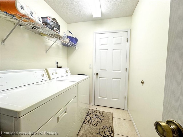 3216 Locust Ave, Lake Placid, FL 33852 - washroom with washing machine and dryer, light tile patterned flooring, and a textured ceiling