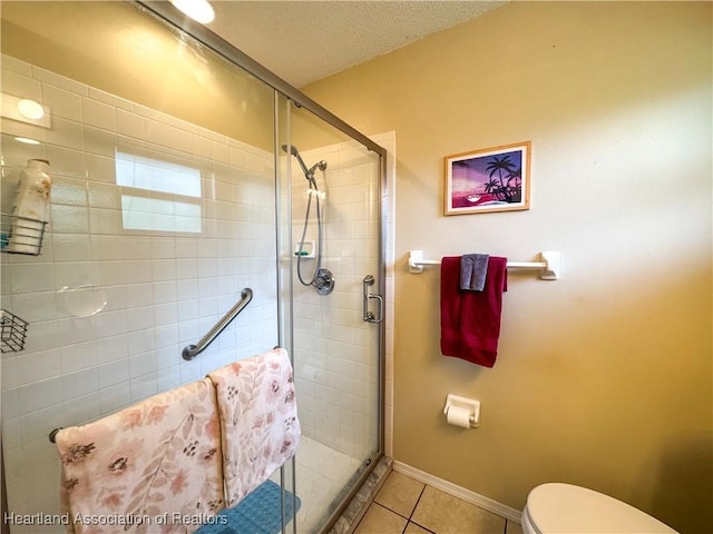 3216 Locust Ave, Lake Placid, FL 33852 - full bath featuring a stall shower, tile patterned flooring, and a textured ceiling