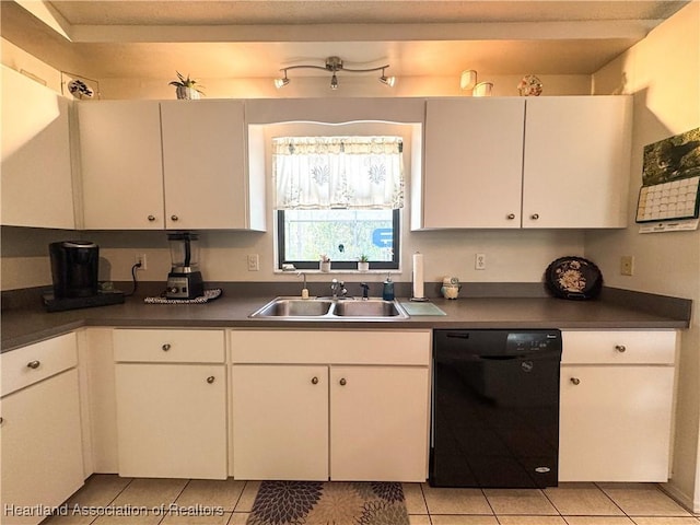 3216 Locust Ave, Lake Placid, FL 33852 - kitchen featuring black dishwasher, dark countertops, light tile patterned floors, and white cabinets
