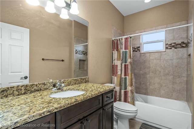 full bathroom featuring vanity, shower / bath combination with curtain, and toilet