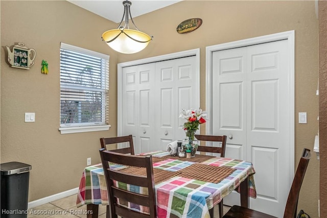 dining room featuring tile patterned flooring