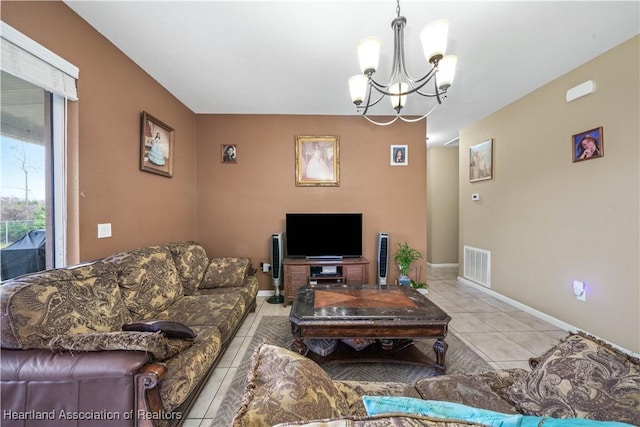 tiled living room with an inviting chandelier