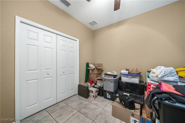 interior space with ceiling fan