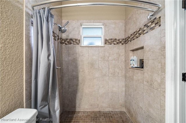 bathroom with toilet and curtained shower