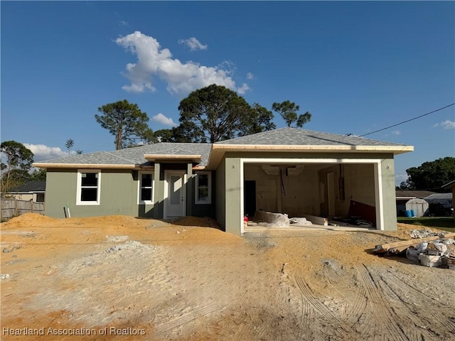 view of front of house featuring a garage and stucco siding