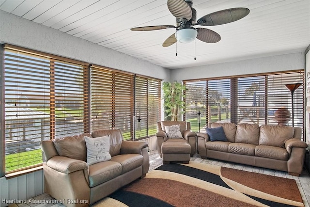 sunroom featuring a ceiling fan