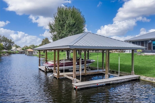 dock area featuring a lawn, a water view, and boat lift