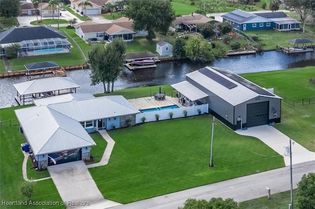 birds eye view of property featuring a water view and a residential view