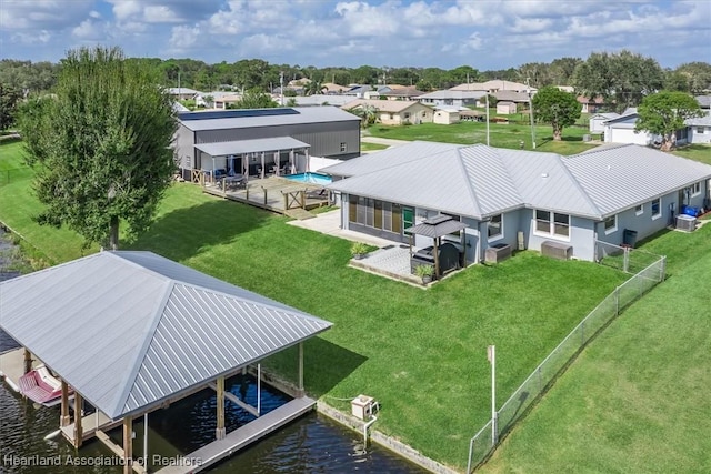 birds eye view of property featuring a water view and a residential view