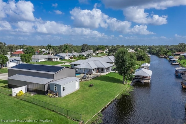 aerial view with a water view and a residential view