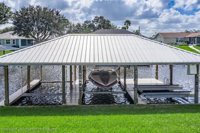 dock area with a yard and boat lift