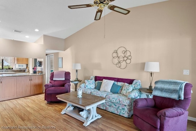 4845 Casablanca Cir Unit F23, Sebring, FL 33870 - living room featuring a ceiling fan, light wood-type flooring, high vaulted ceiling, and recessed lighting