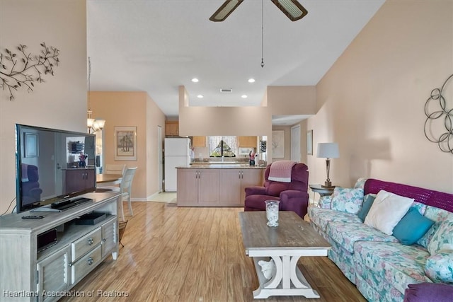 4845 Casablanca Cir Unit F23, Sebring, FL 33870 - living area featuring light wood-style flooring, a chandelier, ceiling fan, recessed lighting, and baseboards