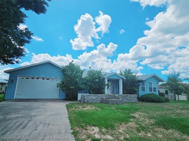 view of front facade featuring a front lawn and a garage