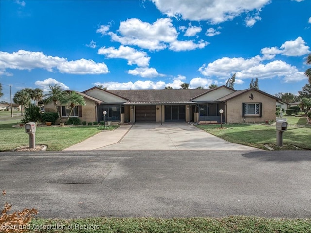 single story home featuring a garage and a front yard