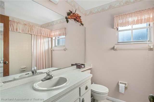 bathroom with vanity and toilet