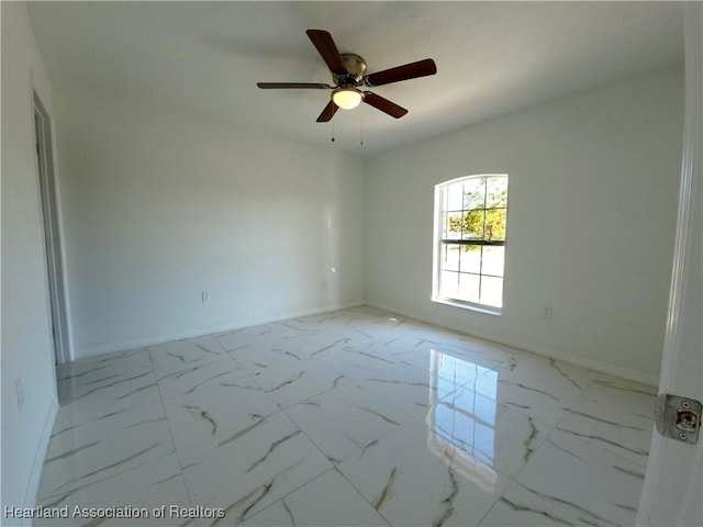 spare room featuring ceiling fan