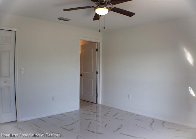 spare room featuring ceiling fan