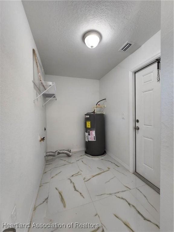 utility room featuring electric water heater