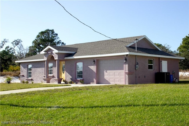 ranch-style home with central AC, a garage, and a front lawn