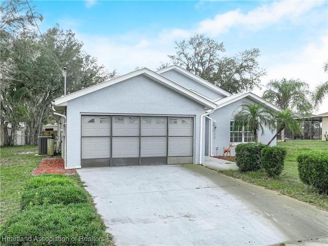 view of front of house with a garage and a front yard