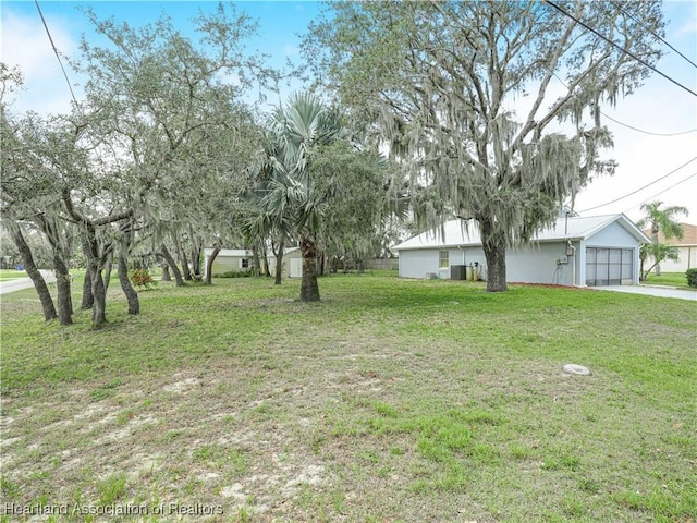 view of yard featuring a garage