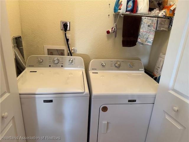 laundry room featuring separate washer and dryer