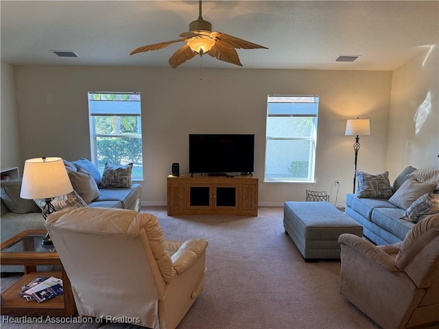 living room featuring ceiling fan and light colored carpet