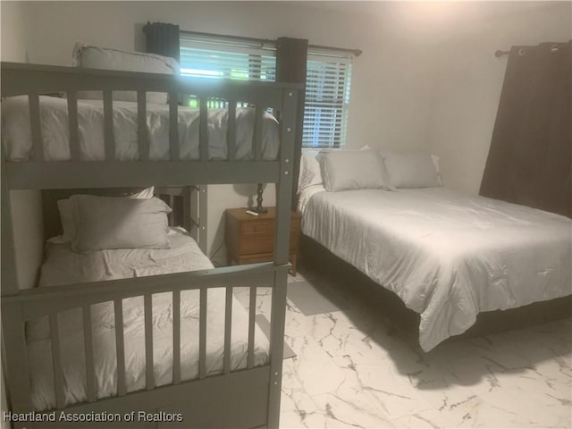 bedroom with marble finish floor