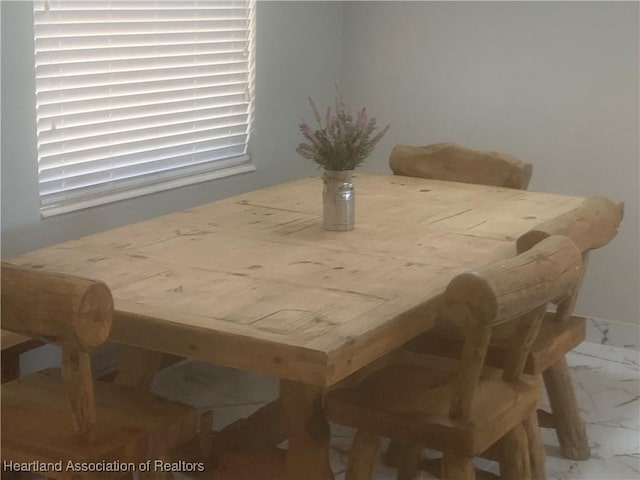 dining room with marble finish floor