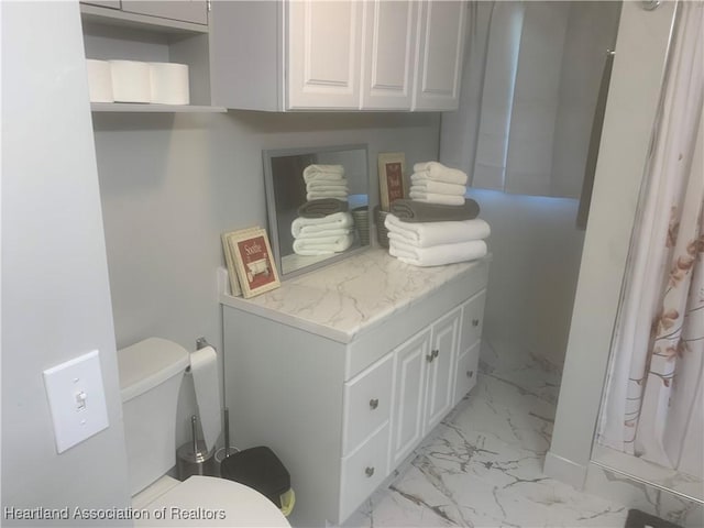 washroom featuring marble finish floor