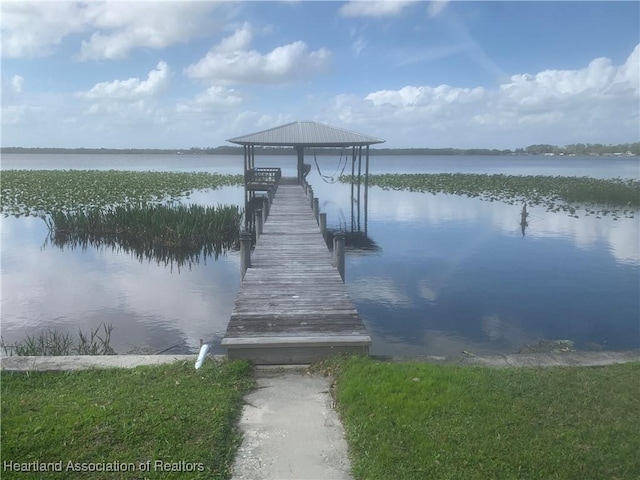 view of dock with a water view