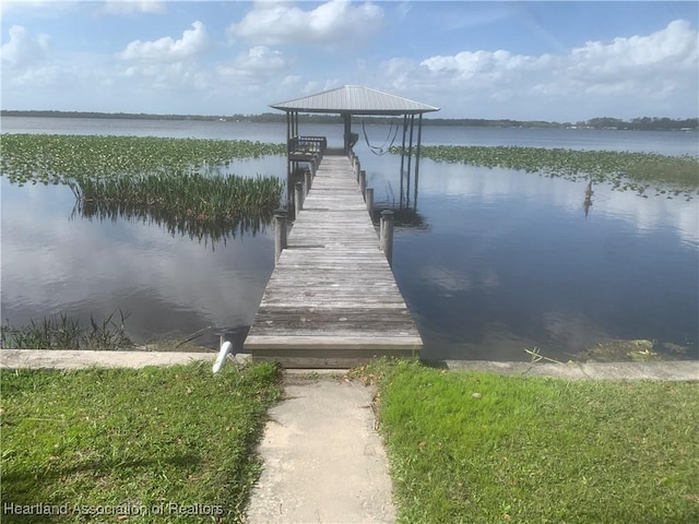 dock area featuring a water view