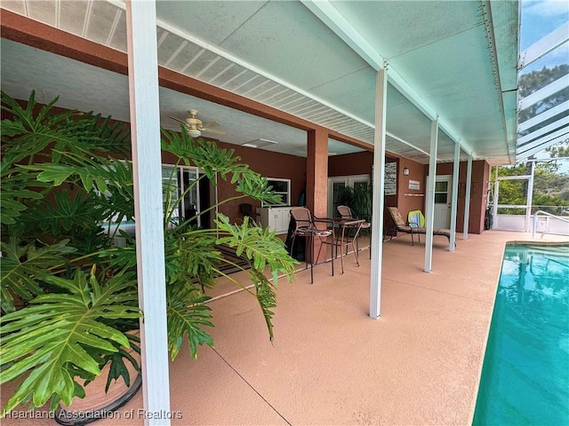 5717 Longbow Dr, Sebring, FL 33876 - outdoor pool with a patio area, a lanai, and a ceiling fan