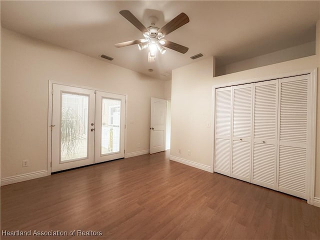 5717 Longbow Dr, Sebring, FL 33876 - unfurnished bedroom featuring access to exterior, wood finished floors, french doors, a ceiling fan, and a closet