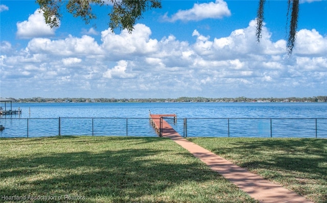 exterior space with a water view and a yard