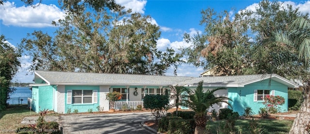 ranch-style home with covered porch