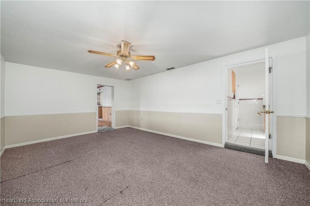 carpeted empty room with ceiling fan