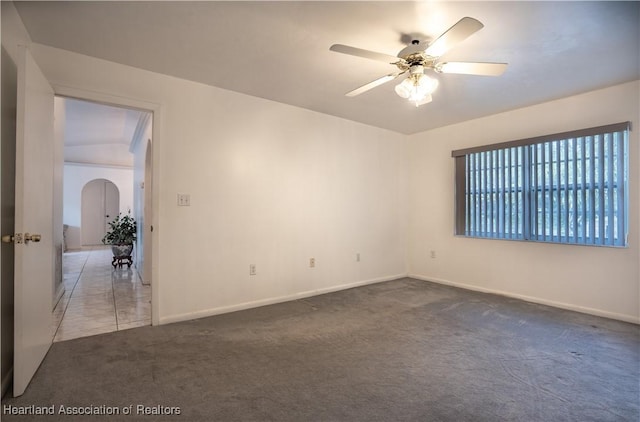 671 Lake Tina Dr, Lake Placid, FL 33852 - carpeted spare room with a ceiling fan, arched walkways, and baseboards