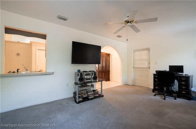 671 Lake Tina Dr, Lake Placid, FL 33852 - office with carpet, a ceiling fan, and arched walkways