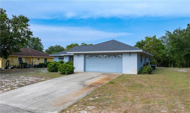 671 Lake Tina Dr, Lake Placid, FL 33852 - view of front of property featuring stucco siding, a garage, central air condition unit, and driveway