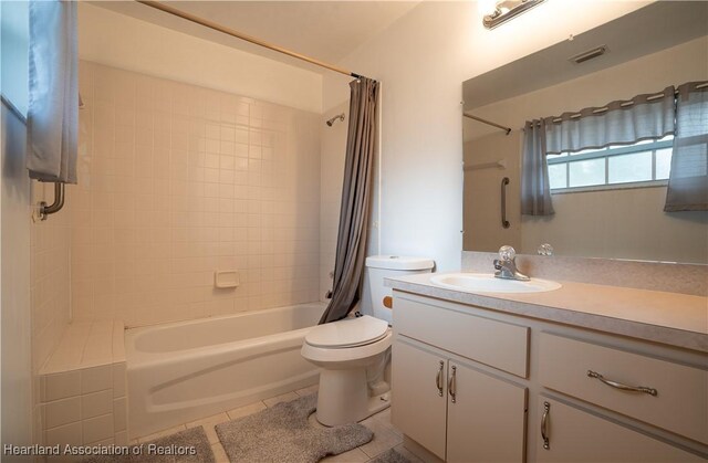671 Lake Tina Dr, Lake Placid, FL 33852 - full bath featuring tile patterned flooring, toilet, shower / bath combination with curtain, and vanity