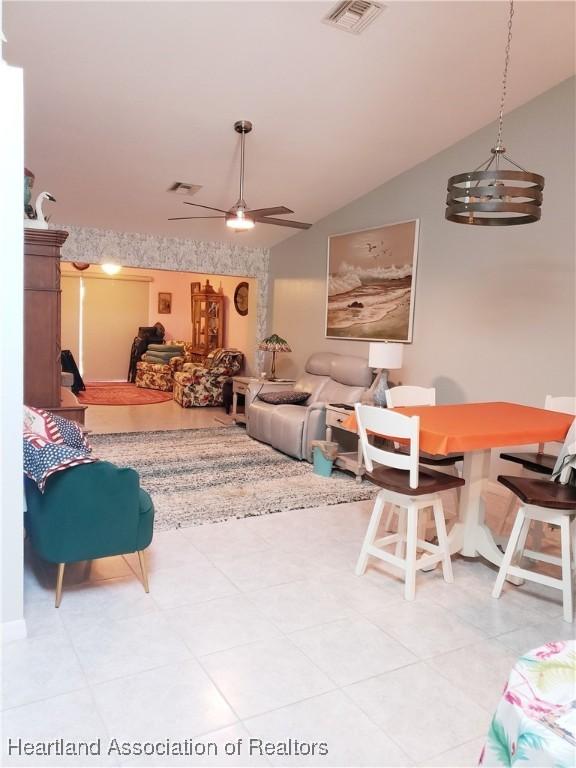 6401 Matanzas Dr, Sebring, FL 33872 - living area featuring lofted ceiling, ceiling fan, and light tile patterned floors