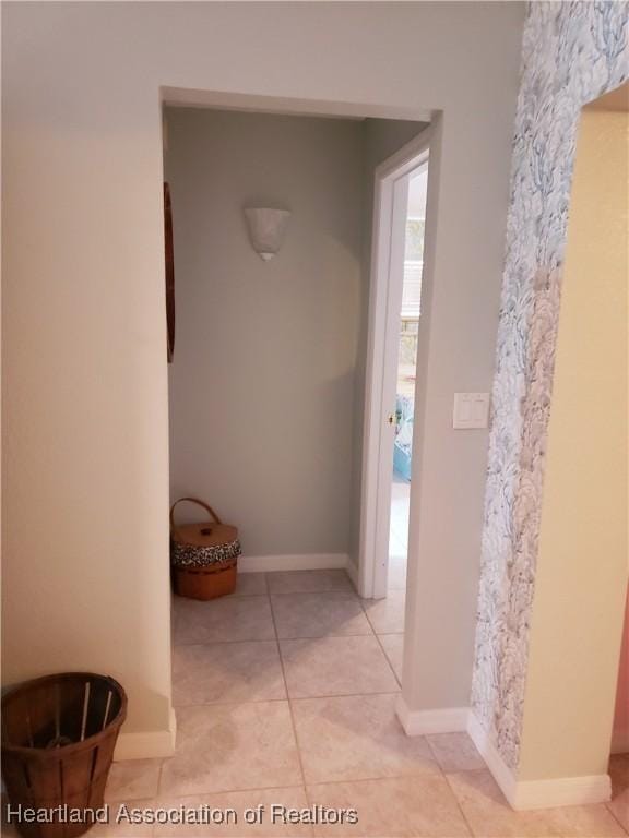 6401 Matanzas Dr, Sebring, FL 33872 - hallway with light tile patterned floors